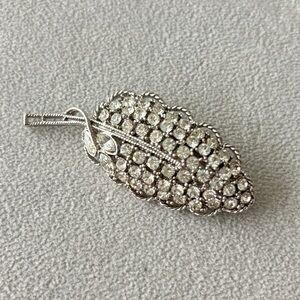 Silver tone and rhinestone leaf pin brooch